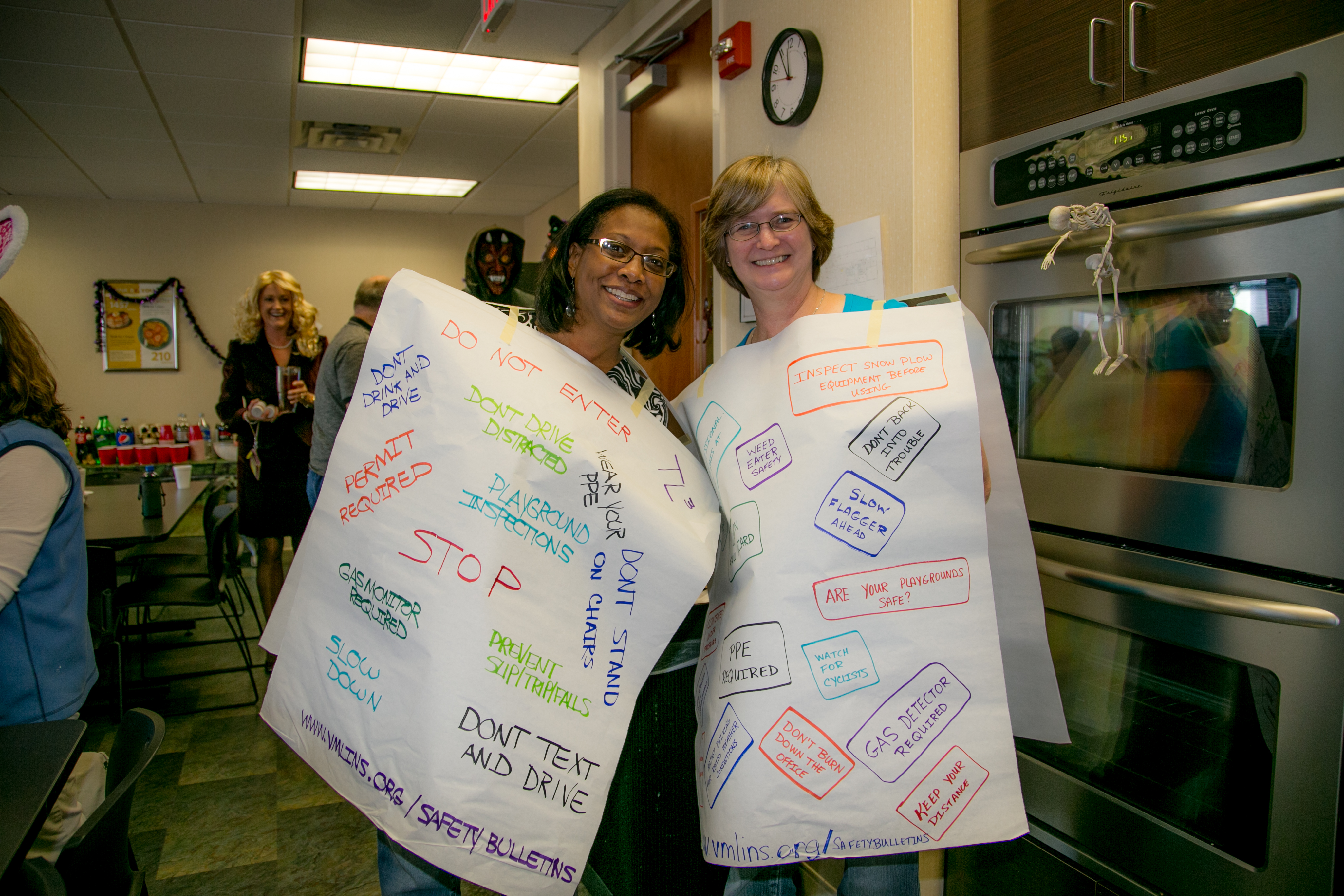 Halloween 2014: Wall and Senior Safety Consultant Fonda Craig dressed as "Safety Bulletins"