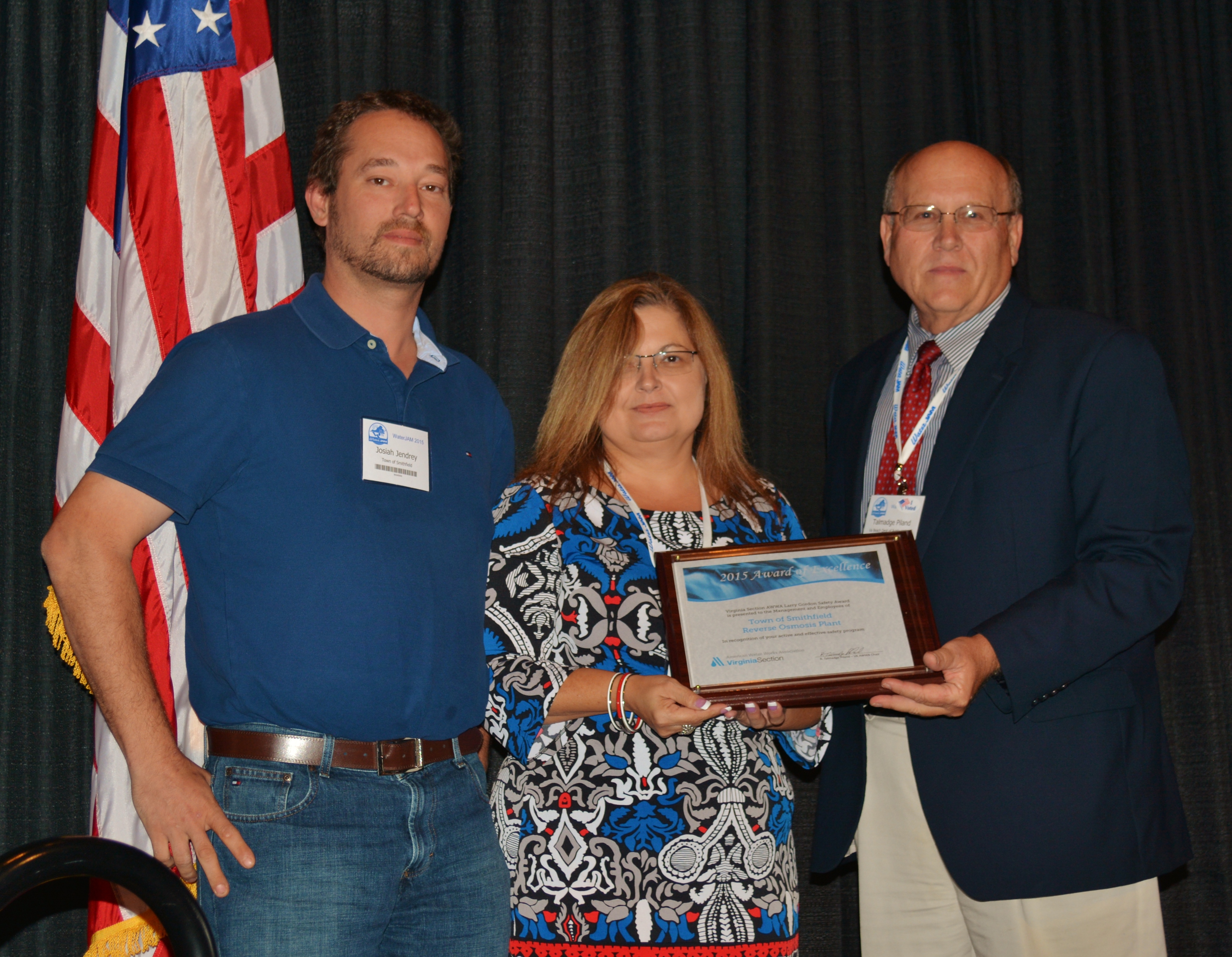 Josiah Jendrey, compliance inspector and Sonja Eubank, planning, engineering and public works with the Town of Smithfield. receive the VA AWWA Larry Gordon Safety Award from Talmadge Piland, chair of the AWWA Virginia Section Board of Trustees